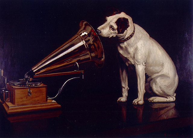 Dog Looking at and Listening to a Phonograph, "His Master's Voice", The Original RCA Music Puppy Dog Logo Symbol for Advertising