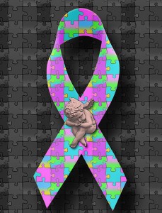 Autism Awarness Cause Ribbon of Colorful Puzzle Pieces with a Cherub Angel Figurine Statue of a Child